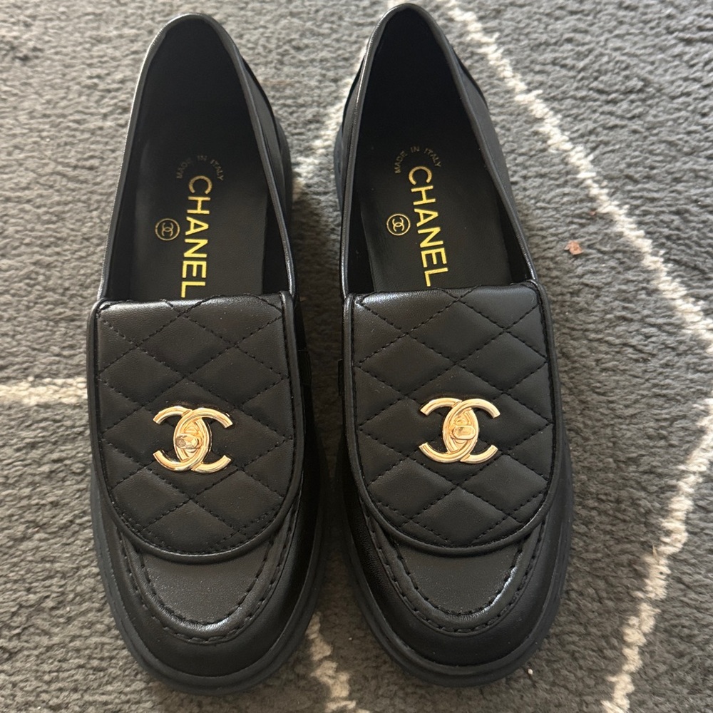 Quilted Black Loafers with Gold Emblem